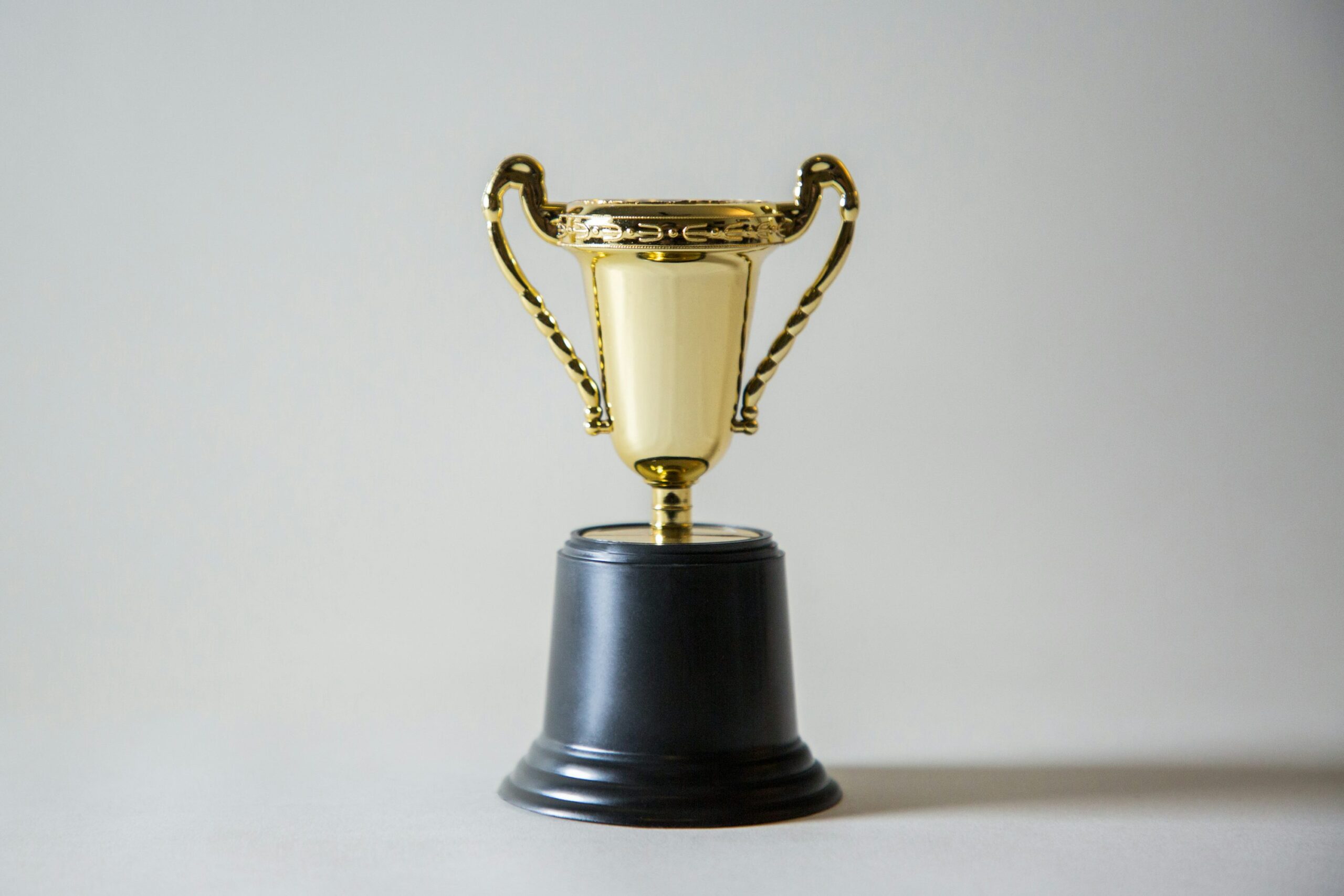 yellow and white trophy representing the victory of getting rich without wealthy parents.